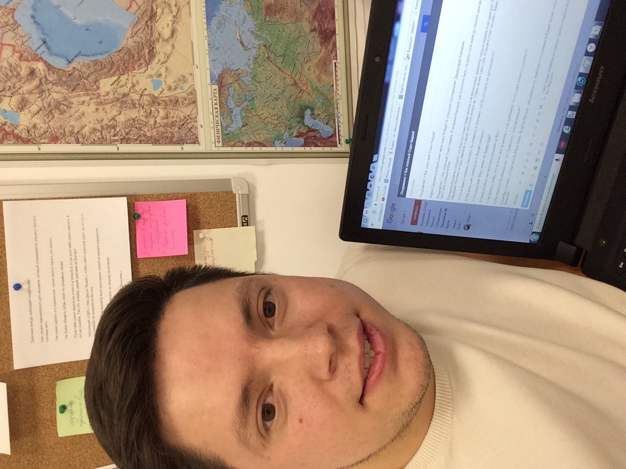 Robert Ivanov working with a laptop at the agency
